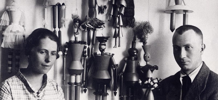 'E. Linck: Sophie Taeuber and Hans Arp in front of puppets, 1918, Stiftung Arp e.V., Berlin/Rolandswerth