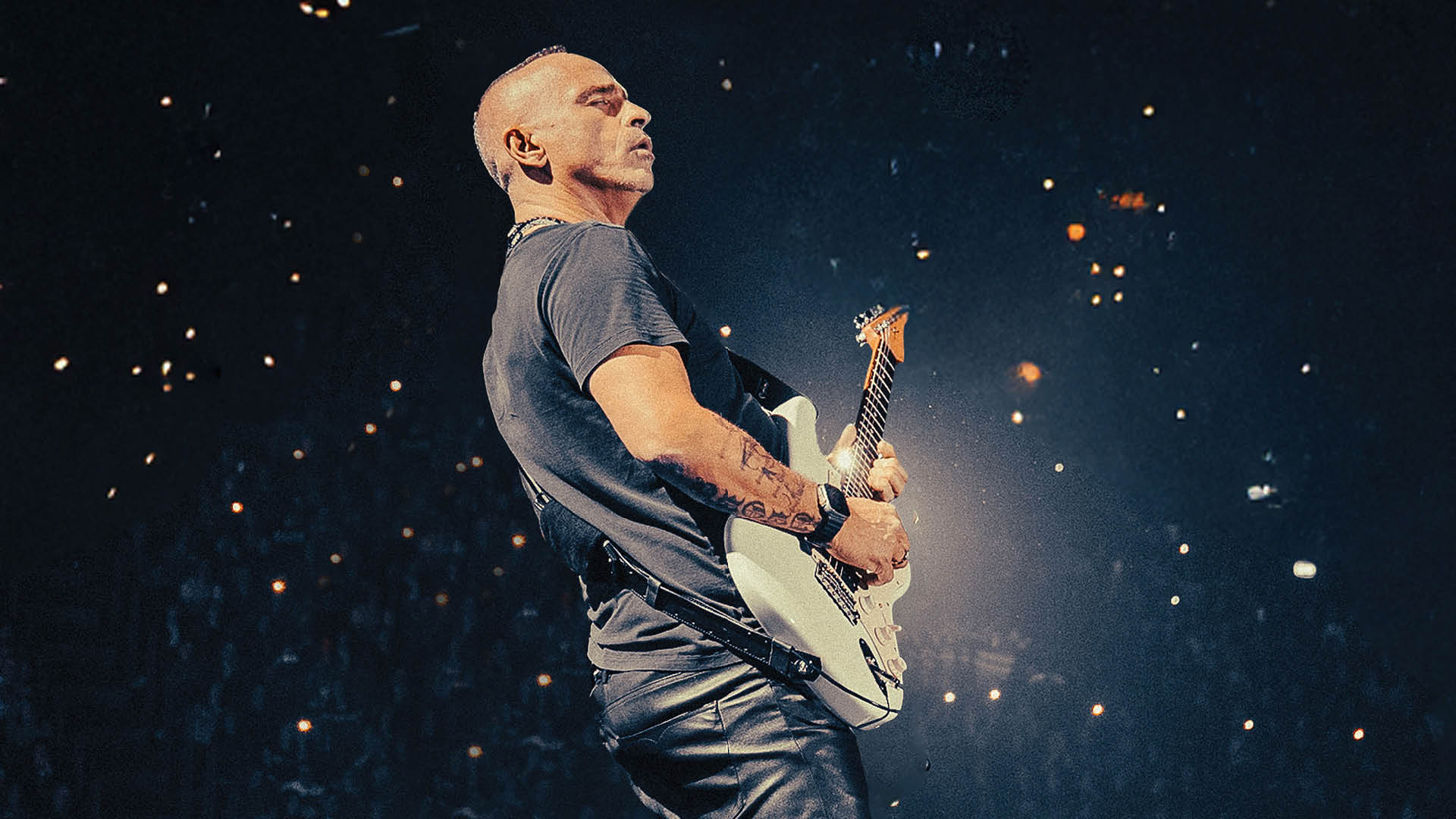 Eros Ramazzotti performing at a concert in 2026